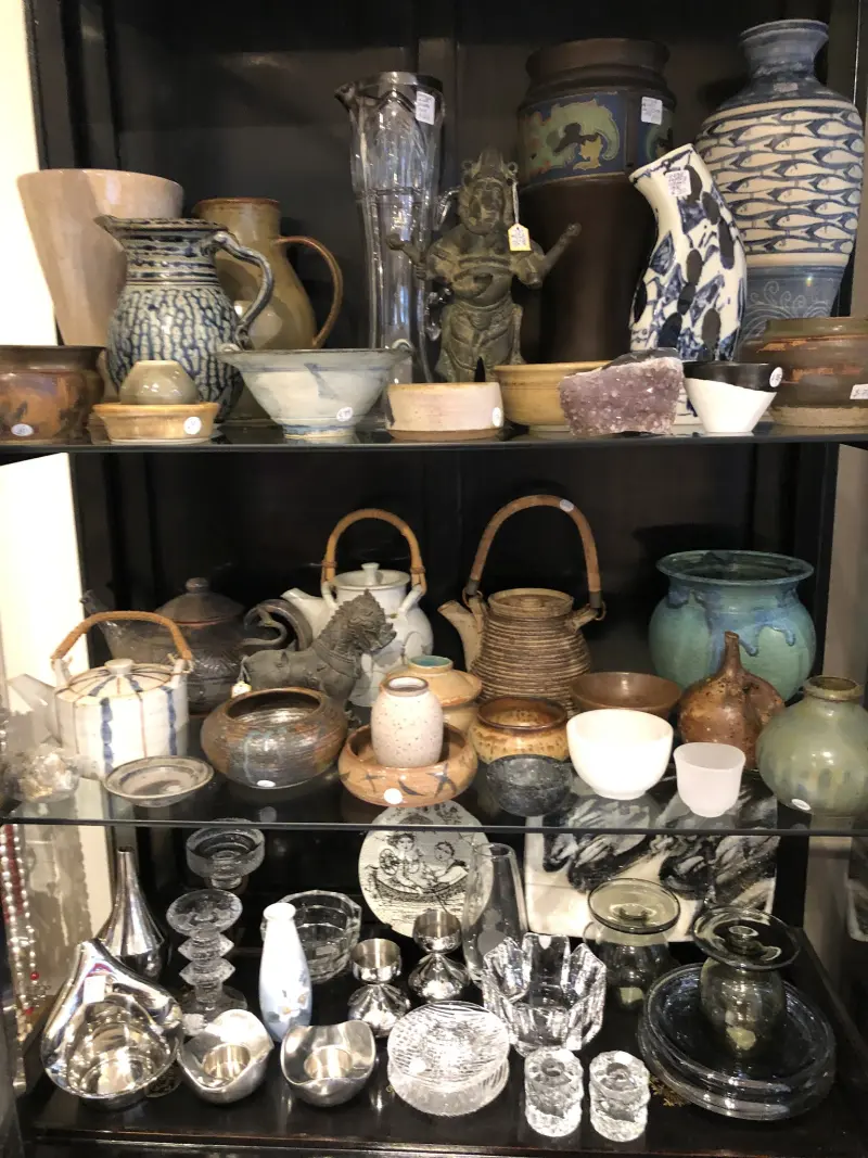 Shelves of Danish and Australian studio pottery at Uuli's antique shop, Manly